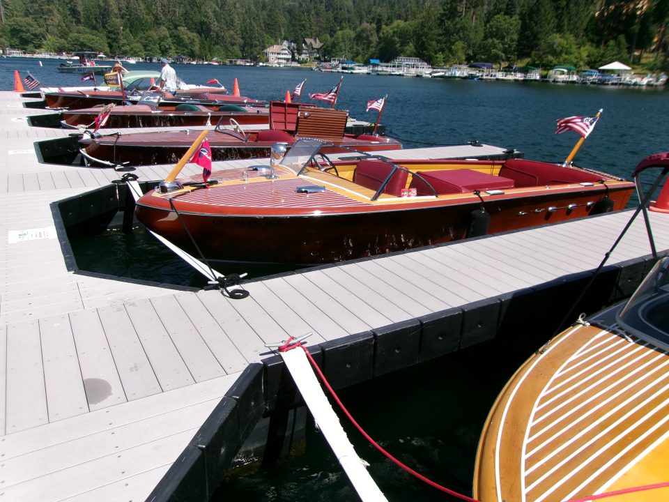 Adrianne, Lisa, Julia, Melissa and Adrianna from Glendora and Orange County enjoyed last year’s Brewfest at Tavern Bay Beach Club so much they couldn’t resist attending this year’s event. (Photos by Douglas W. Motley) Wooden speedboats docked on a sunny lake