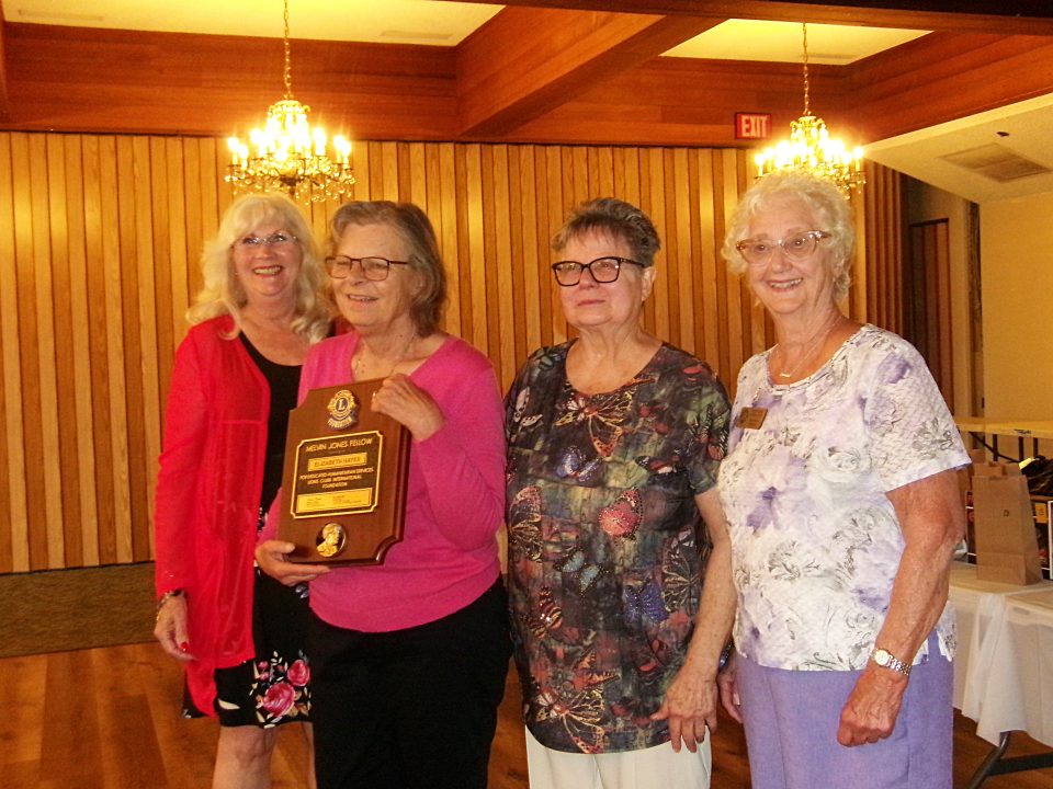 Adrianne, Lisa, Julia, Melissa and Adrianna from Glendora and Orange County enjoyed last year’s Brewfest at Tavern Bay Beach Club so much they couldn’t resist attending this year’s event. (Photos by Douglas W. Motley) Four women at an award ceremony with a plaque.