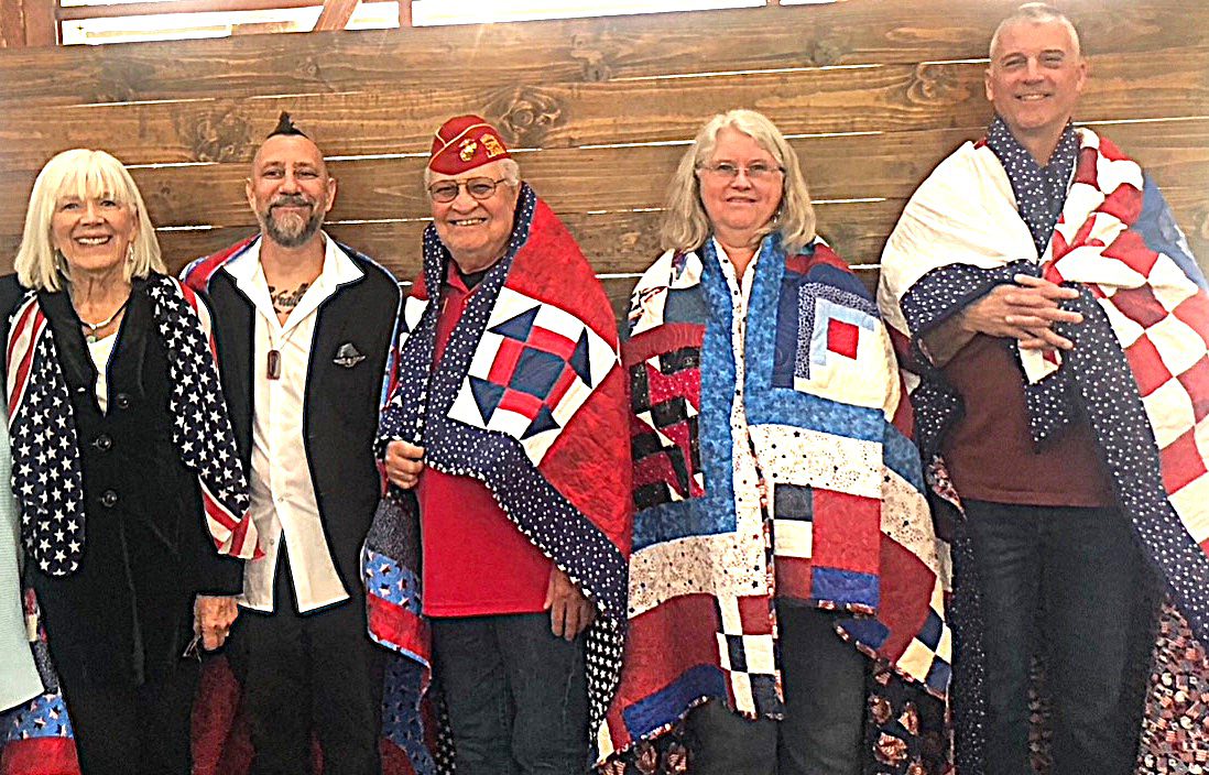 Adrianne, Lisa, Julia, Melissa and Adrianna from Glendora and Orange County enjoyed last year’s Brewfest at Tavern Bay Beach Club so much they couldn’t resist attending this year’s event. (Photos by Douglas W. Motley) Group with patriotic quilts at quilt event