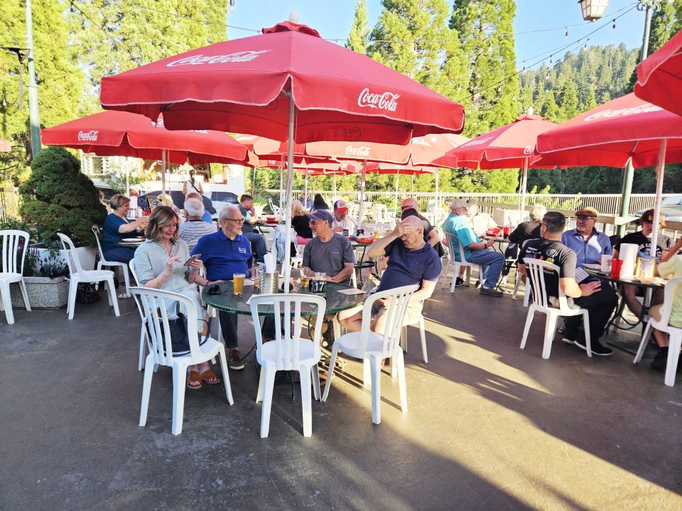 Adrianne, Lisa, Julia, Melissa and Adrianna from Glendora and Orange County enjoyed last year’s Brewfest at Tavern Bay Beach Club so much they couldn’t resist attending this year’s event. (Photos by Douglas W. Motley) People dining outdoors under red umbrellas
