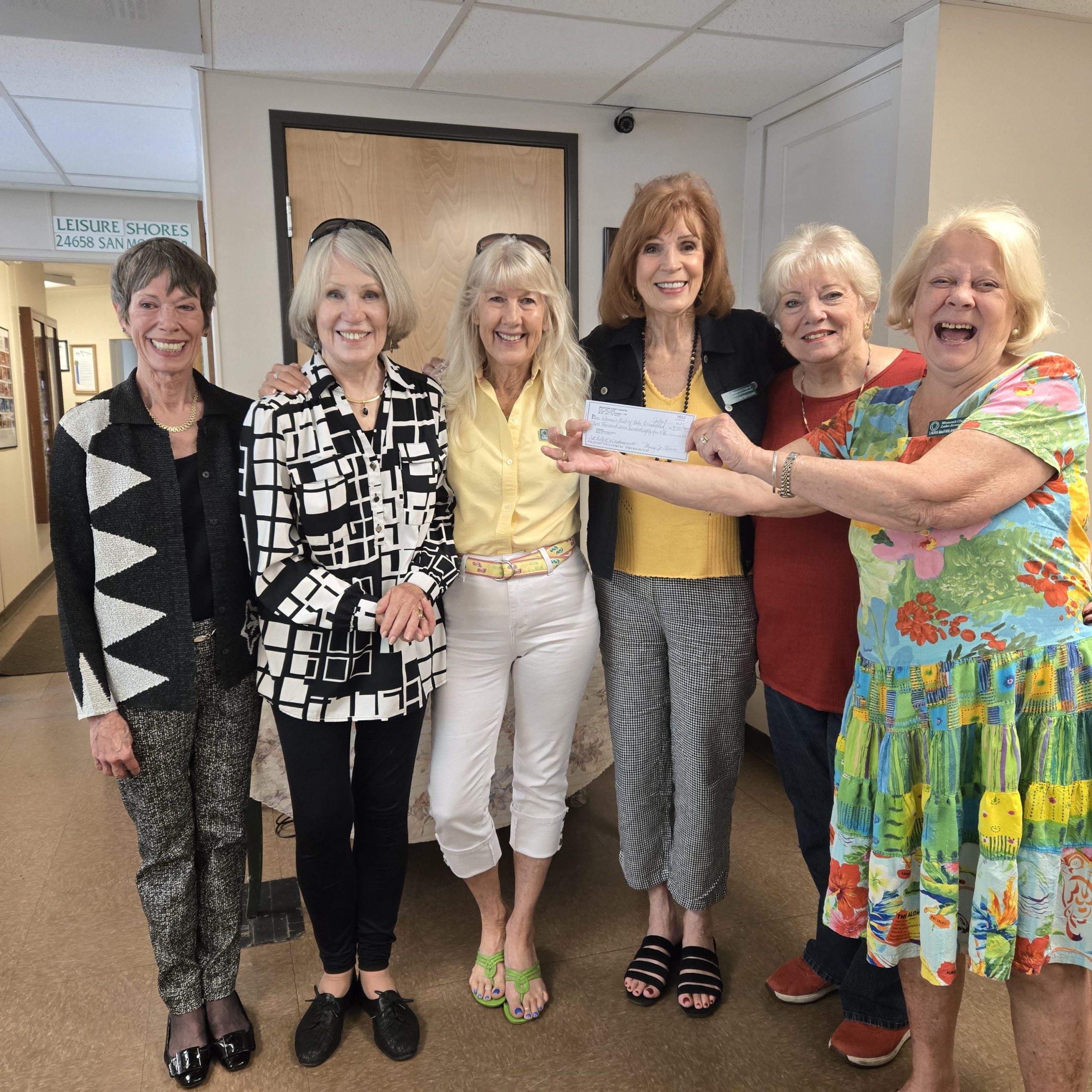 Adrianne, Lisa, Julia, Melissa and Adrianna from Glendora and Orange County enjoyed last year’s Brewfest at Tavern Bay Beach Club so much they couldn’t resist attending this year’s event. (Photos by Douglas W. Motley) Group of women holding a check together.