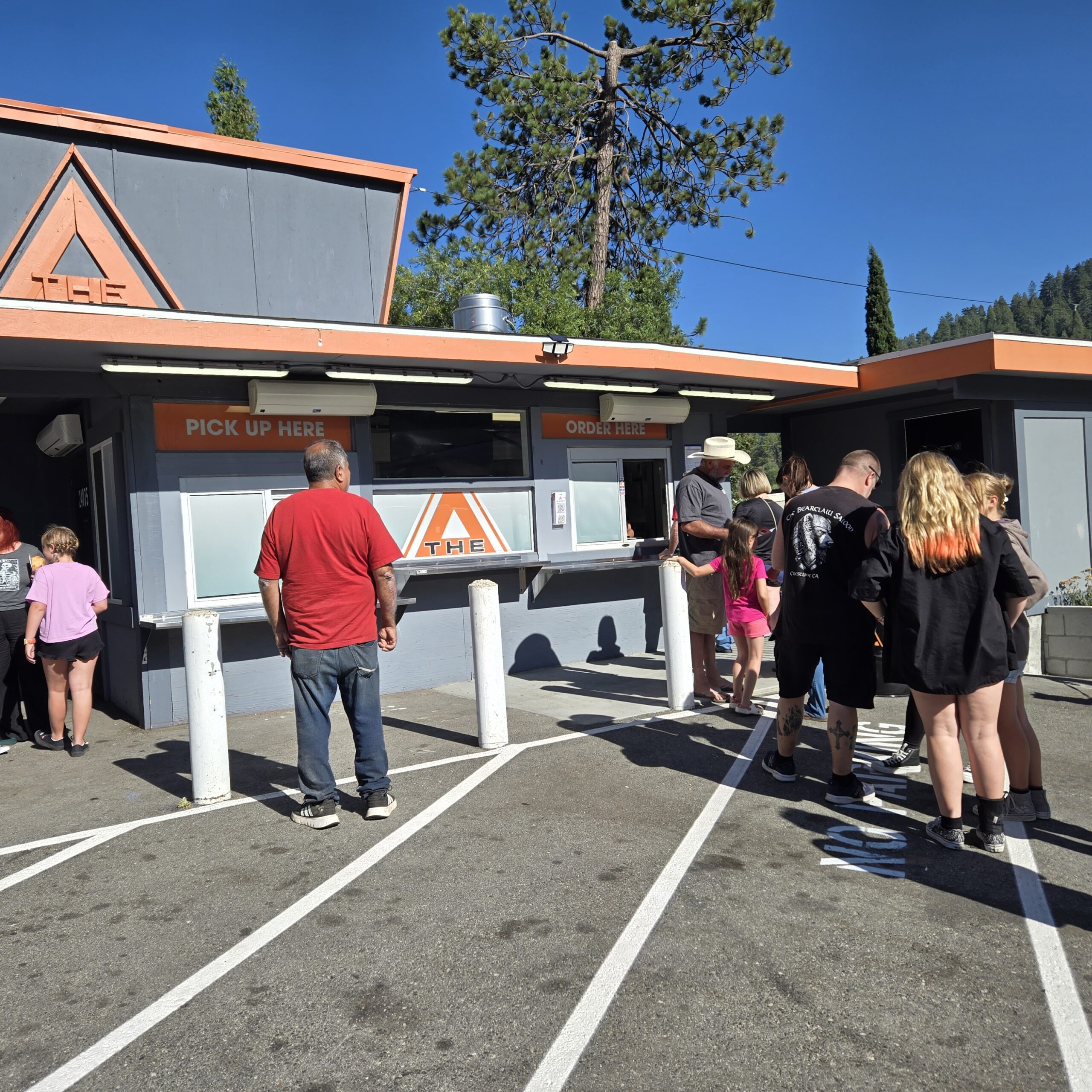 Adrianne, Lisa, Julia, Melissa and Adrianna from Glendora and Orange County enjoyed last year’s Brewfest at Tavern Bay Beach Club so much they couldn’t resist attending this year’s event. (Photos by Douglas W. Motley) People in line at outdoor food stand.