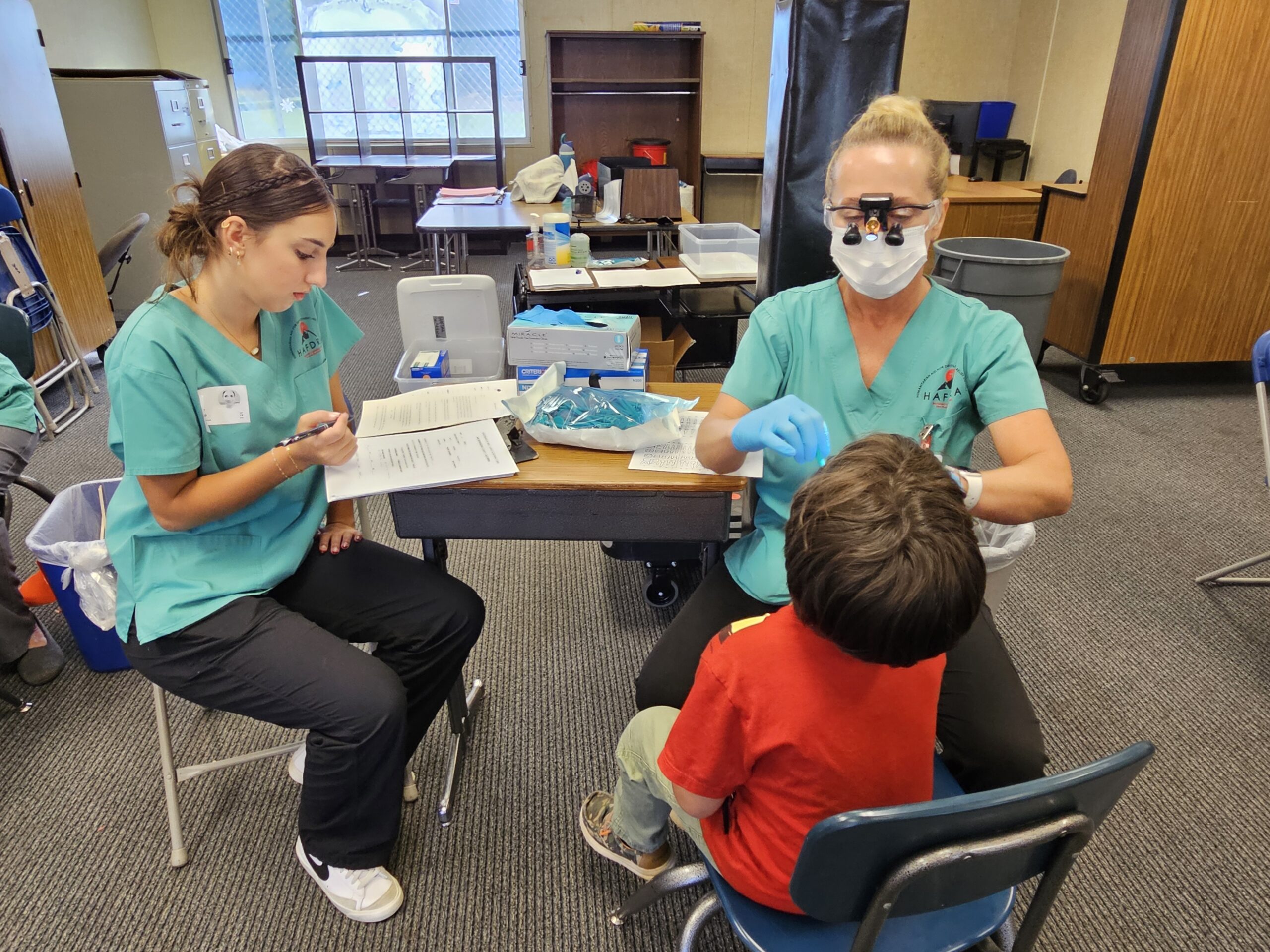 Adrianne, Lisa, Julia, Melissa and Adrianna from Glendora and Orange County enjoyed last year’s Brewfest at Tavern Bay Beach Club so much they couldn’t resist attending this year’s event. (Photos by Douglas W. Motley) Dental professionals examining child in clinic setting.