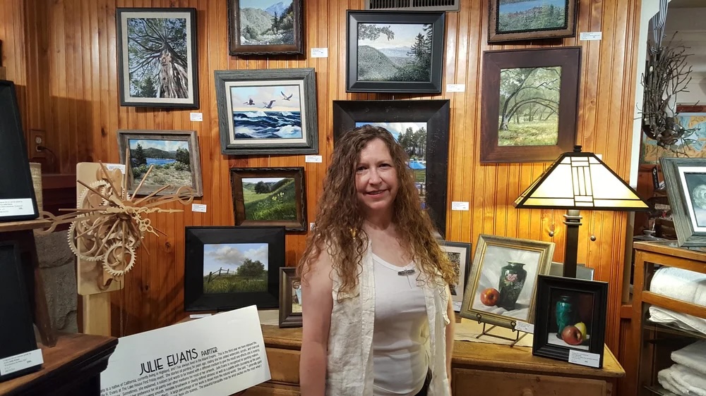 Adrianne, Lisa, Julia, Melissa and Adrianna from Glendora and Orange County enjoyed last year’s Brewfest at Tavern Bay Beach Club so much they couldn’t resist attending this year’s event. (Photos by Douglas W. Motley) Woman in art gallery with paintings display.