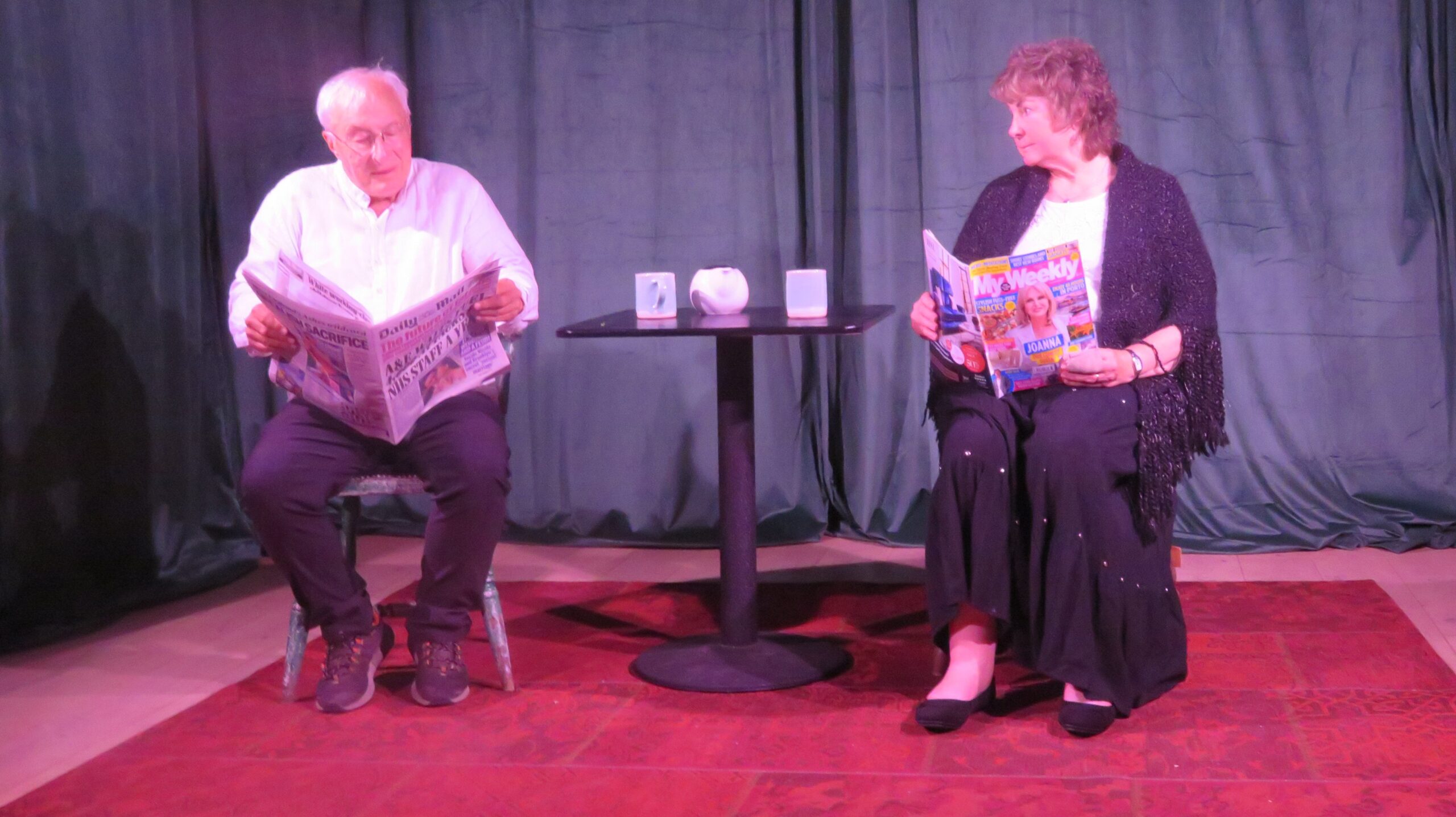 Adrianne, Lisa, Julia, Melissa and Adrianna from Glendora and Orange County enjoyed last year’s Brewfest at Tavern Bay Beach Club so much they couldn’t resist attending this year’s event. (Photos by Douglas W. Motley) Elderly couple reading newspapers on stage.