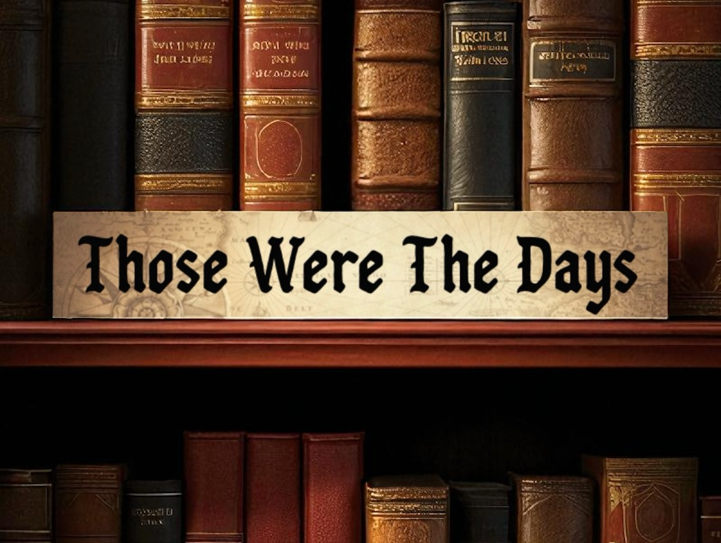 Sign reads 'Those Were The Days' on bookshelf.