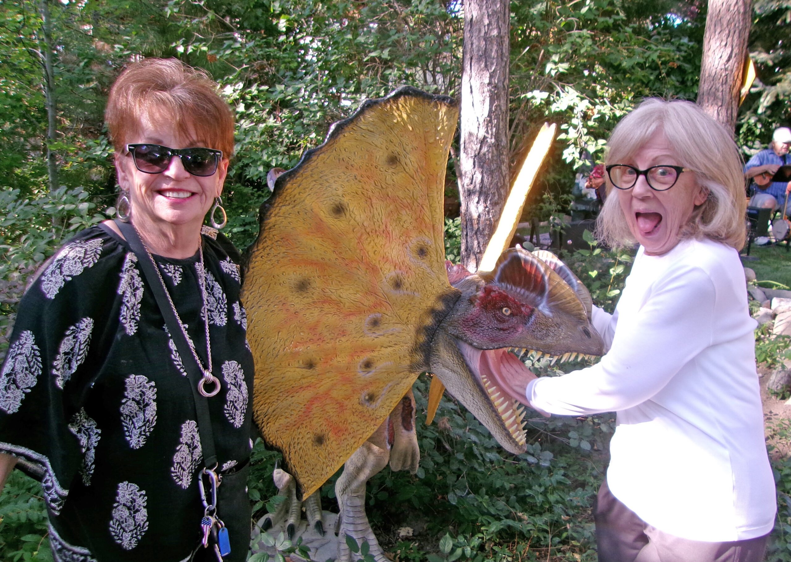 Adrianne, Lisa, Julia, Melissa and Adrianna from Glendora and Orange County enjoyed last year’s Brewfest at Tavern Bay Beach Club so much they couldn’t resist attending this year’s event. (Photos by Douglas W. Motley) Two women posing with a dinosaur statue.