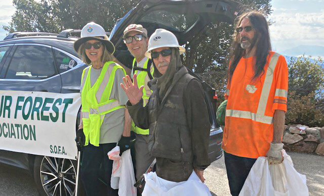 Adrianne, Lisa, Julia, Melissa and Adrianna from Glendora and Orange County enjoyed last year’s Brewfest at Tavern Bay Beach Club so much they couldn’t resist attending this year’s event. (Photos by Douglas W. Motley) Volunteers in safety gear clean up forest area.