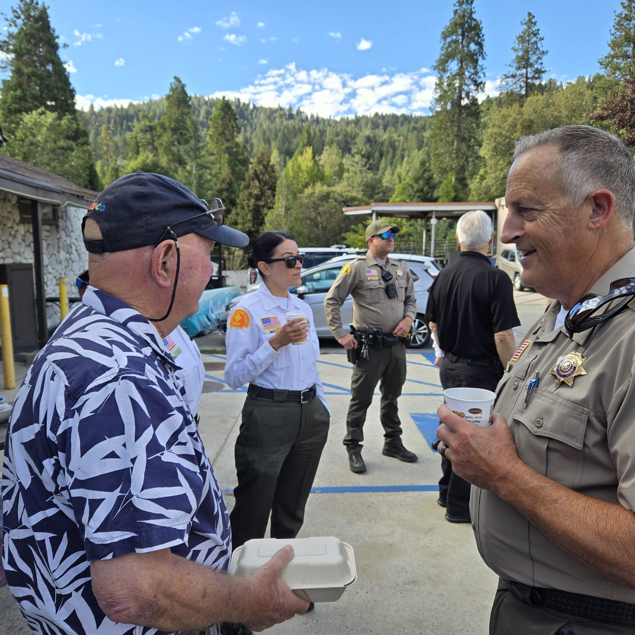 Adrianne, Lisa, Julia, Melissa and Adrianna from Glendora and Orange County enjoyed last year’s Brewfest at Tavern Bay Beach Club so much they couldn’t resist attending this year’s event. (Photos by Douglas W. Motley) Sheriff officers conversing with man outdoors.