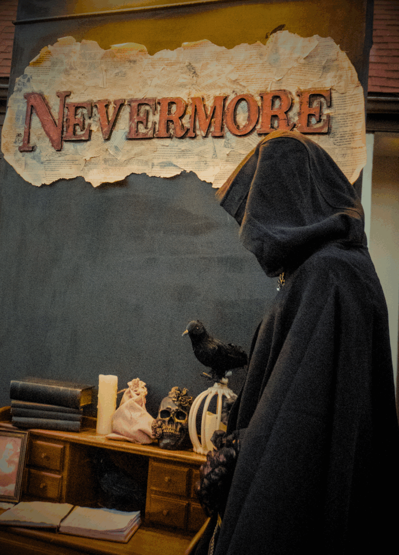 Adrianne, Lisa, Julia, Melissa and Adrianna from Glendora and Orange County enjoyed last year’s Brewfest at Tavern Bay Beach Club so much they couldn’t resist attending this year’s event. (Photos by Douglas W. Motley) Hooded figure with raven, skull, and 'Nevermore' sign.