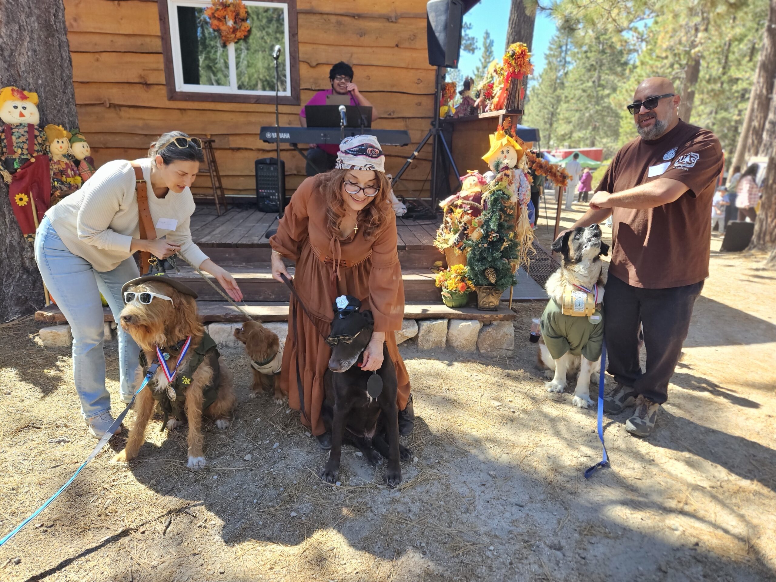 Adrianne, Lisa, Julia, Melissa and Adrianna from Glendora and Orange County enjoyed last year’s Brewfest at Tavern Bay Beach Club so much they couldn’t resist attending this year’s event. (Photos by Douglas W. Motley) Dogs in costumes with people at a fall festival.