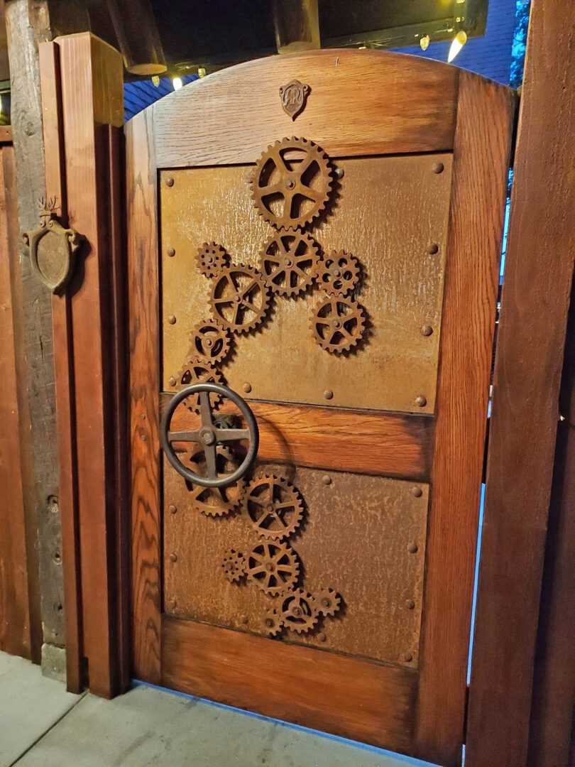 Adrianne, Lisa, Julia, Melissa and Adrianna from Glendora and Orange County enjoyed last year’s Brewfest at Tavern Bay Beach Club so much they couldn’t resist attending this year’s event. (Photos by Douglas W. Motley) Wooden door with gears and metal design.