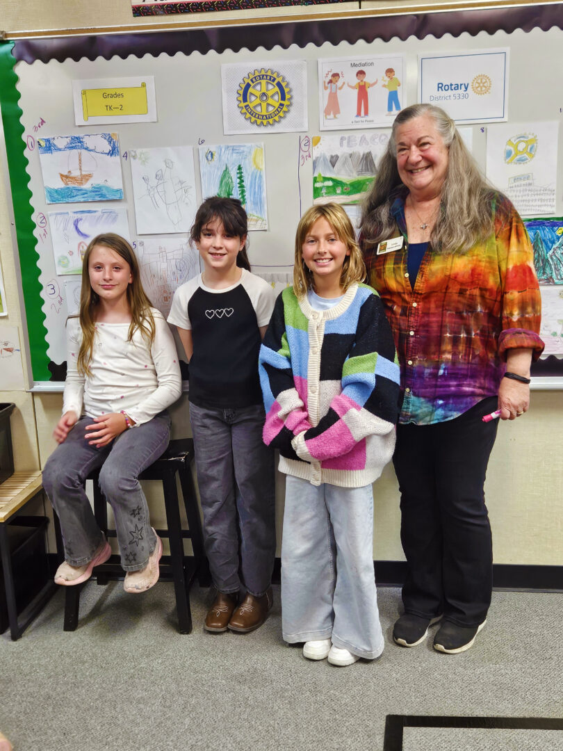 Adrianne, Lisa, Julia, Melissa and Adrianna from Glendora and Orange County enjoyed last year’s Brewfest at Tavern Bay Beach Club so much they couldn’t resist attending this year’s event. (Photos by Douglas W. Motley) Teacher with three students in classroom art display.