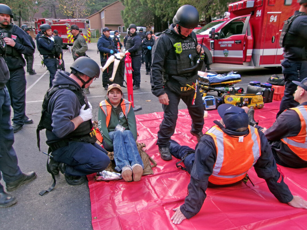 Adrianne, Lisa, Julia, Melissa and Adrianna from Glendora and Orange County enjoyed last year’s Brewfest at Tavern Bay Beach Club so much they couldn’t resist attending this year’s event. (Photos by Douglas W. Motley) Emergency responders assist person during rescue drill.