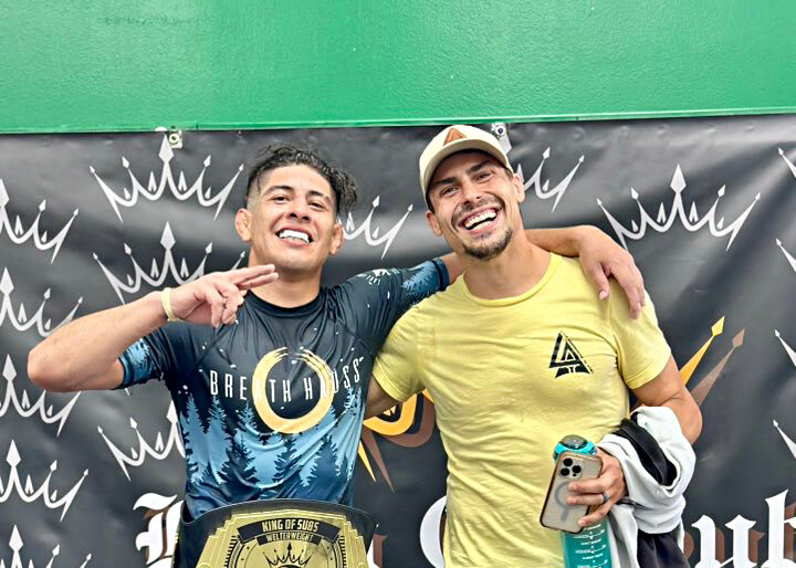 Two men smiling at a sports event