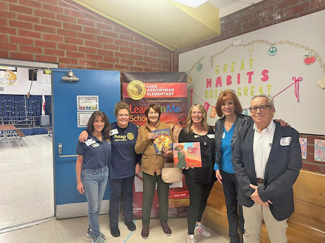 Adrianne, Lisa, Julia, Melissa and Adrianna from Glendora and Orange County enjoyed last year’s Brewfest at Tavern Bay Beach Club so much they couldn’t resist attending this year’s event. (Photos by Douglas W. Motley) Group of people in school hallway with poster.