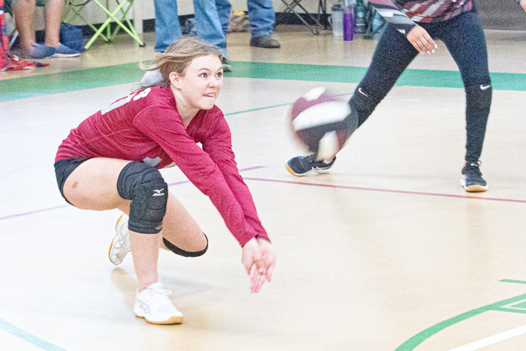 Senior Libero Brooklyn Winter gets low for the dig.