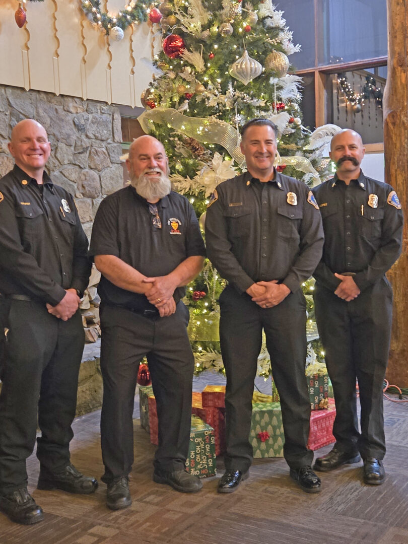 Adrianne, Lisa, Julia, Melissa and Adrianna from Glendora and Orange County enjoyed last year’s Brewfest at Tavern Bay Beach Club so much they couldn’t resist attending this year’s event. (Photos by Douglas W. Motley) Firefighters smiling near decorated Christmas tree.