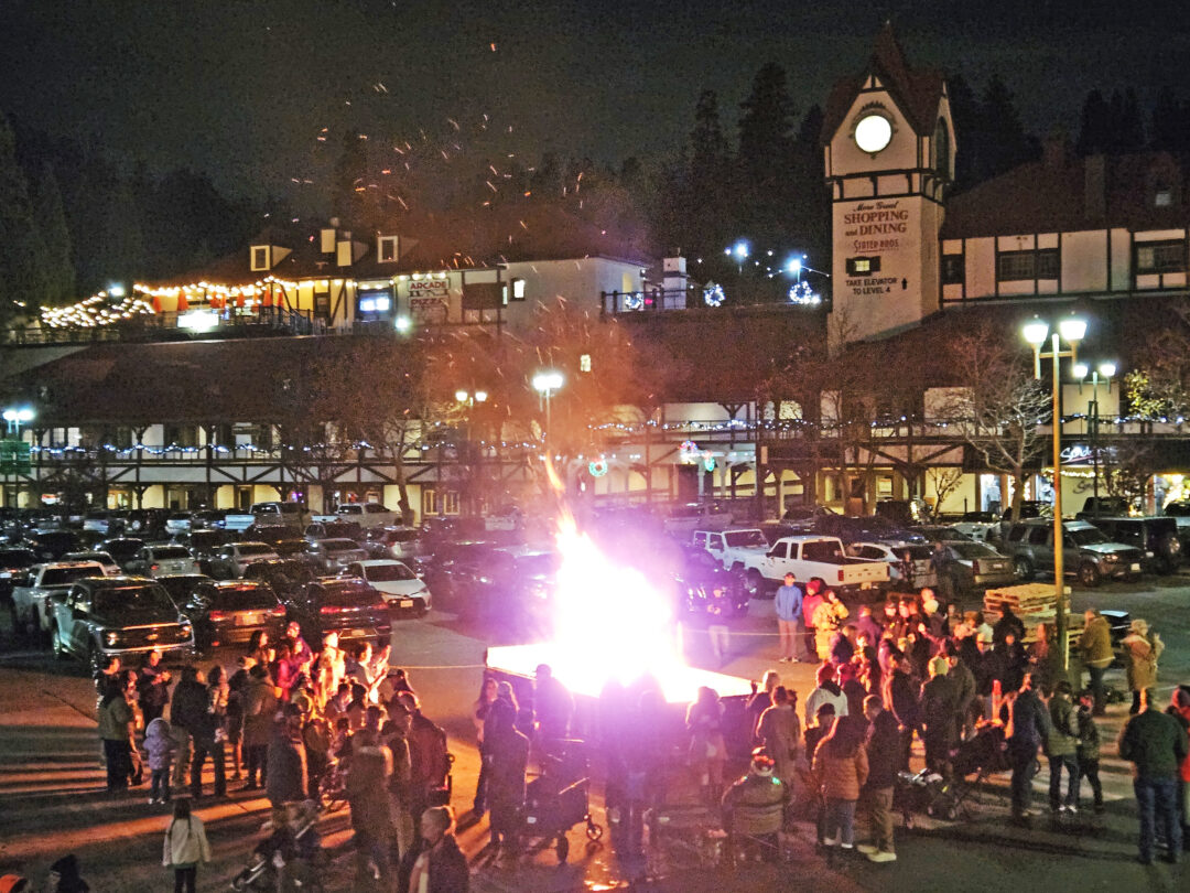 Adrianne, Lisa, Julia, Melissa and Adrianna from Glendora and Orange County enjoyed last year’s Brewfest at Tavern Bay Beach Club so much they couldn’t resist attending this year’s event. (Photos by Douglas W. Motley) Festive crowd gathers around a bonfire at night.