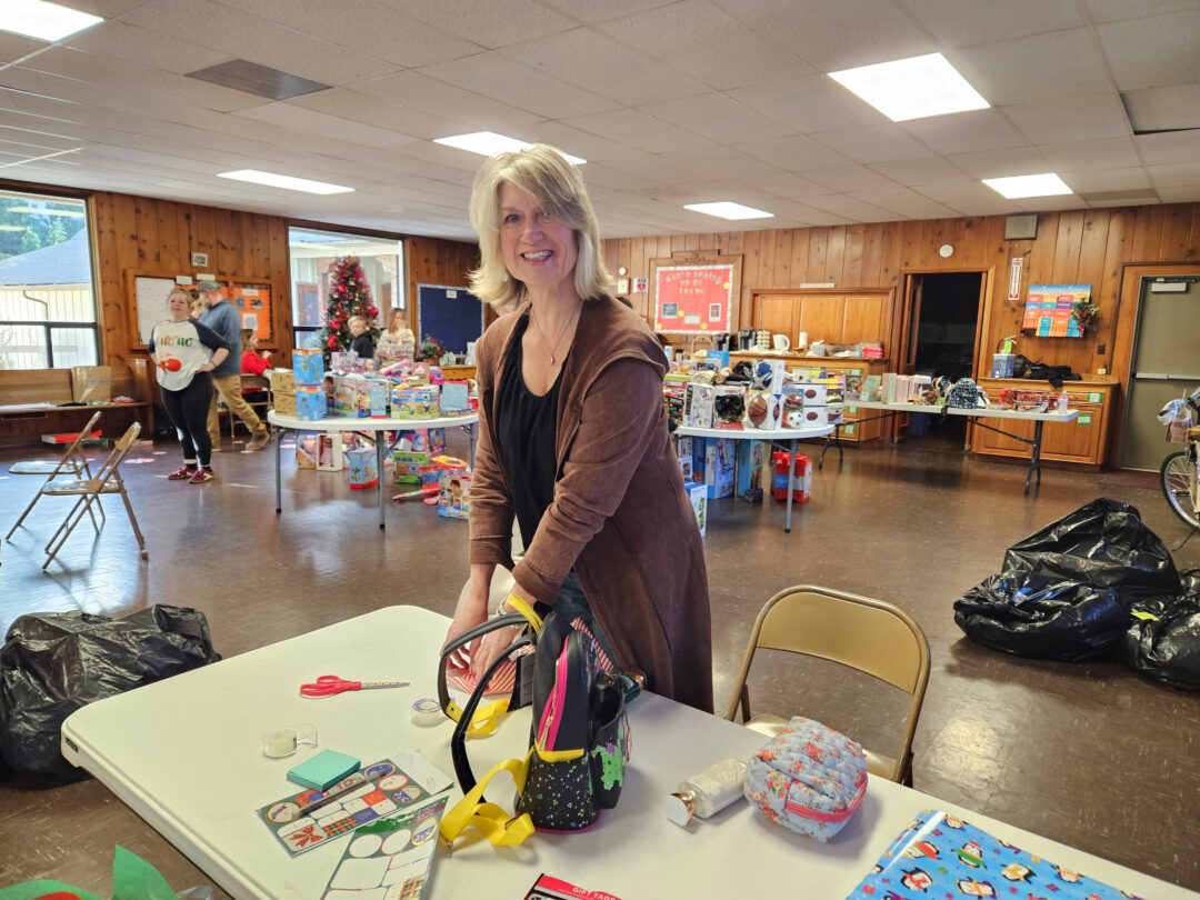 Allison Banner was one of the many volunteers who wrapped the gifts. (Photo by Mary-Justine Lanyon)