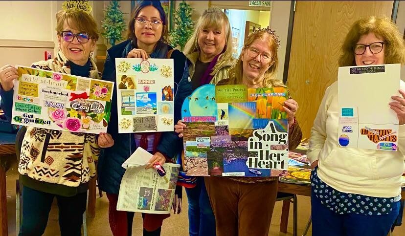 Carrie Forbear, Tamara Bellamy, Vicki Vargas, Rhea-Frances Tetley and Megan Miller show off their vision boards.