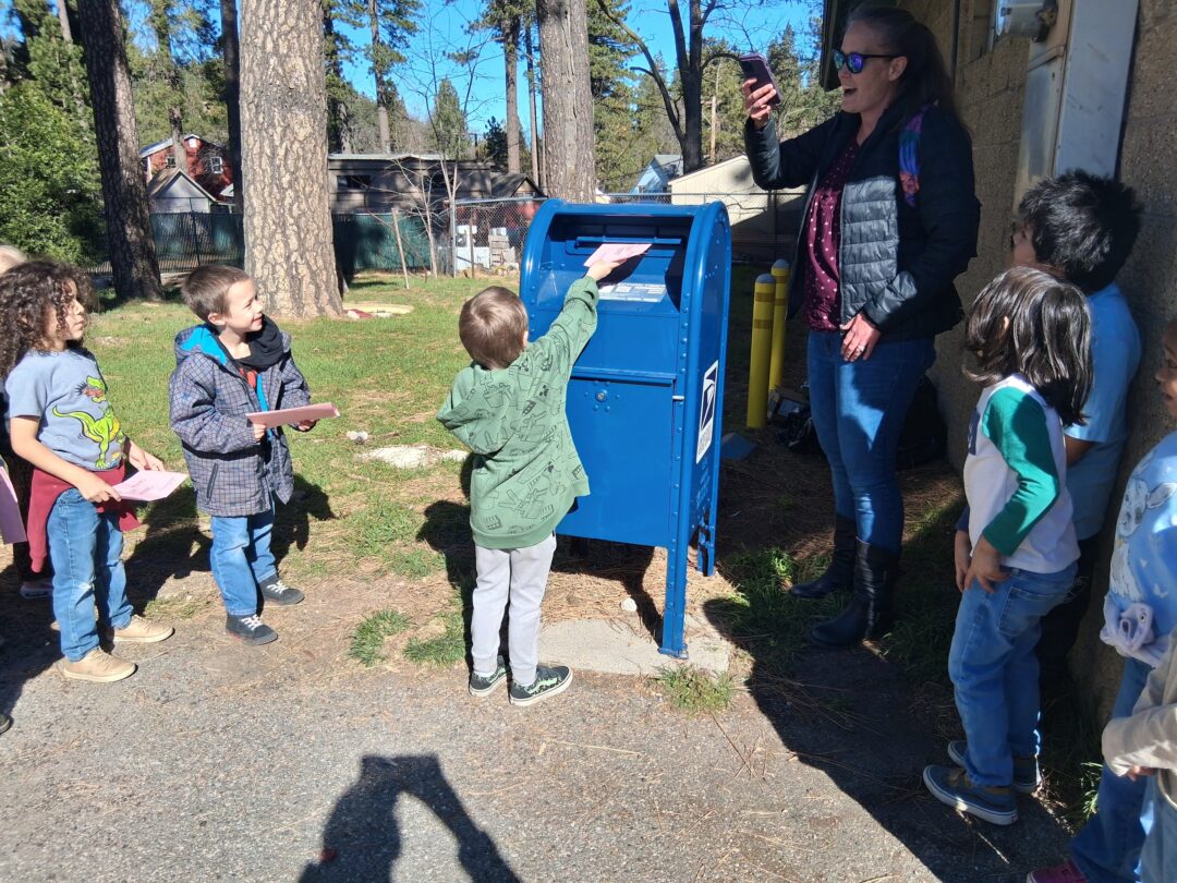 Each student put their letters into the mailbox to be sent to their parents.