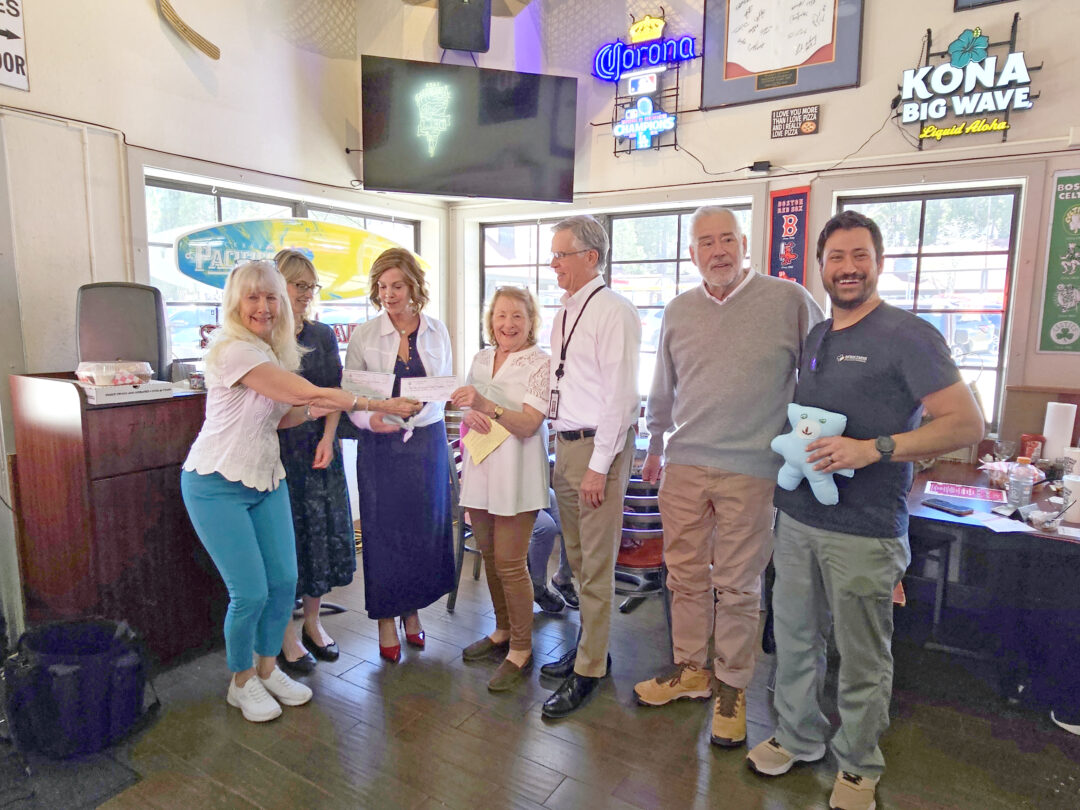 Adrianne, Lisa, Julia, Melissa and Adrianna from Glendora and Orange County enjoyed last year’s Brewfest at Tavern Bay Beach Club so much they couldn’t resist attending this year’s event. (Photos by Douglas W. Motley) Kristin Countryman handed checks to Kim McGuire, MCH Foundation President Susan Sparks and Jeanne Hoy as Mark Turner, MCH board President Gerry Hinkley and Nick Starr looked on. Starr is holding the Boo Boo Bear he received as a young patient at MCH. (Photo by Mary-Justine Lanyon)