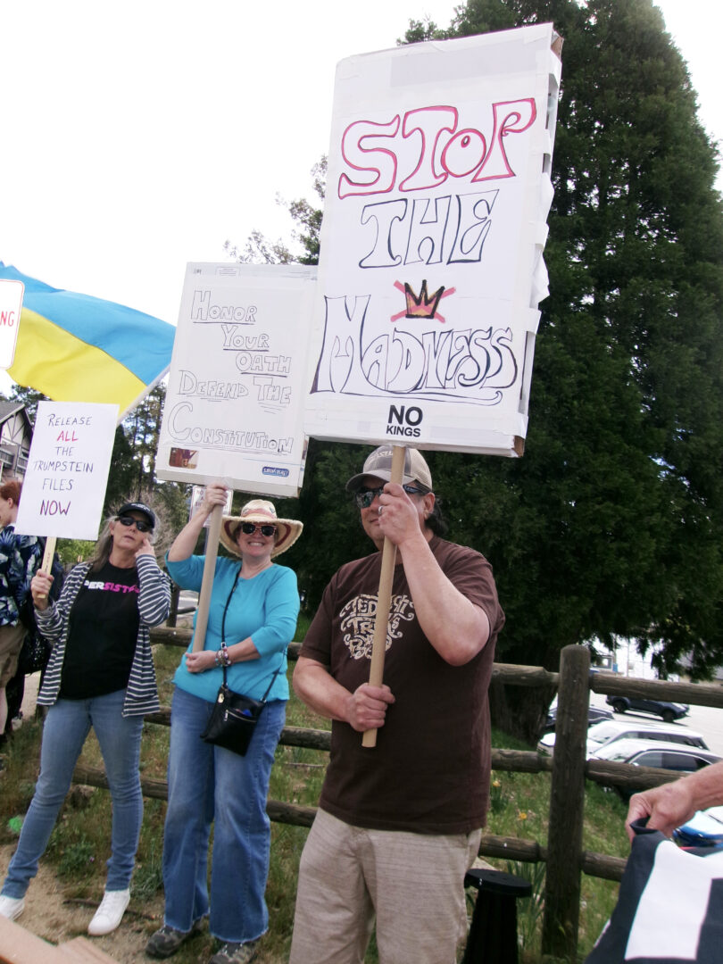 The group was in a good mood as cars drove by and honked. (Photos by Rhea-Frances Tetley)