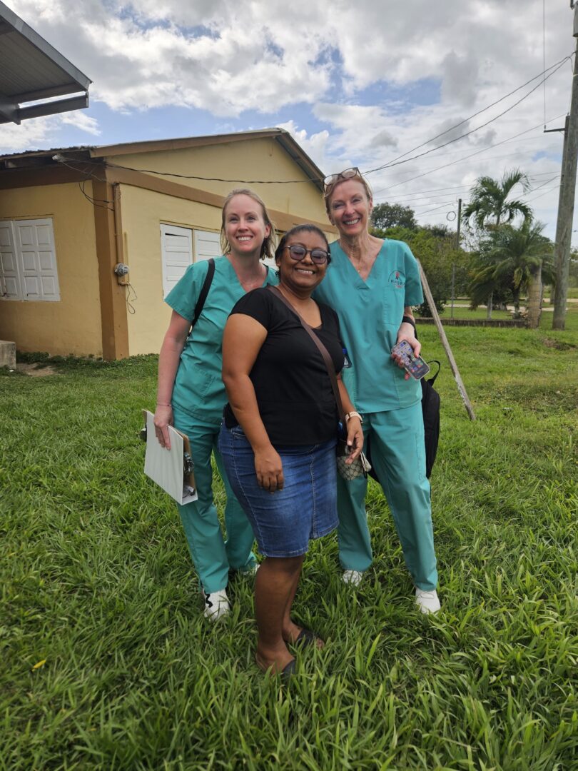Abby and Catherine Savich with Miss Thiffany, the principal of Hills of Promise primary school.