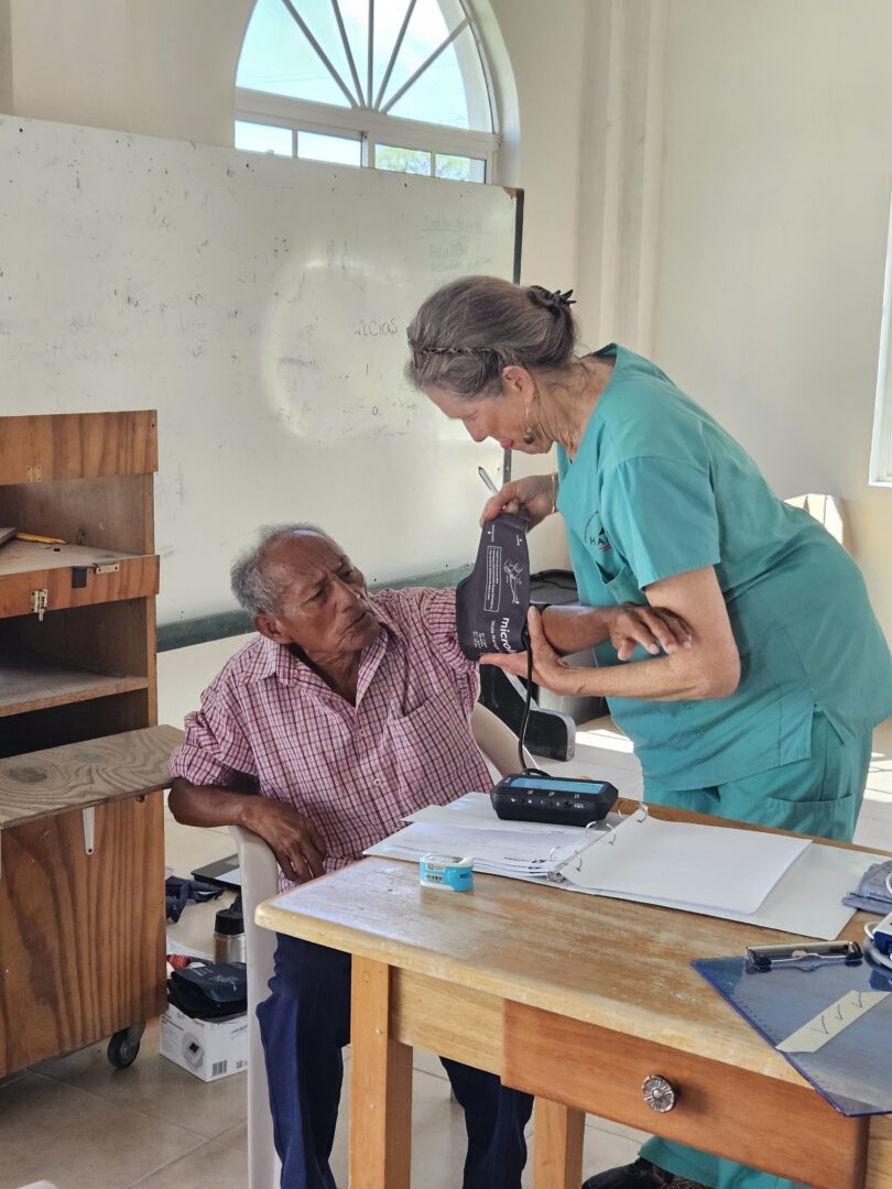 Lori Semeniuk takes this patient’s blood pressure.