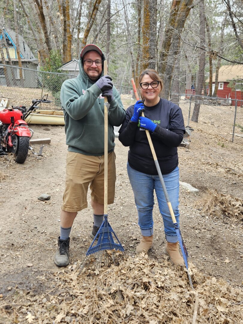 Executive Chef Chris Dennis and HR Coordinator Veronica Amador of the Lake Arrowhead Resort spent the day raking up leaves and pine needles at Judith’s Green Valley Lake home. (Photo by Mary-Justine Lanyon)