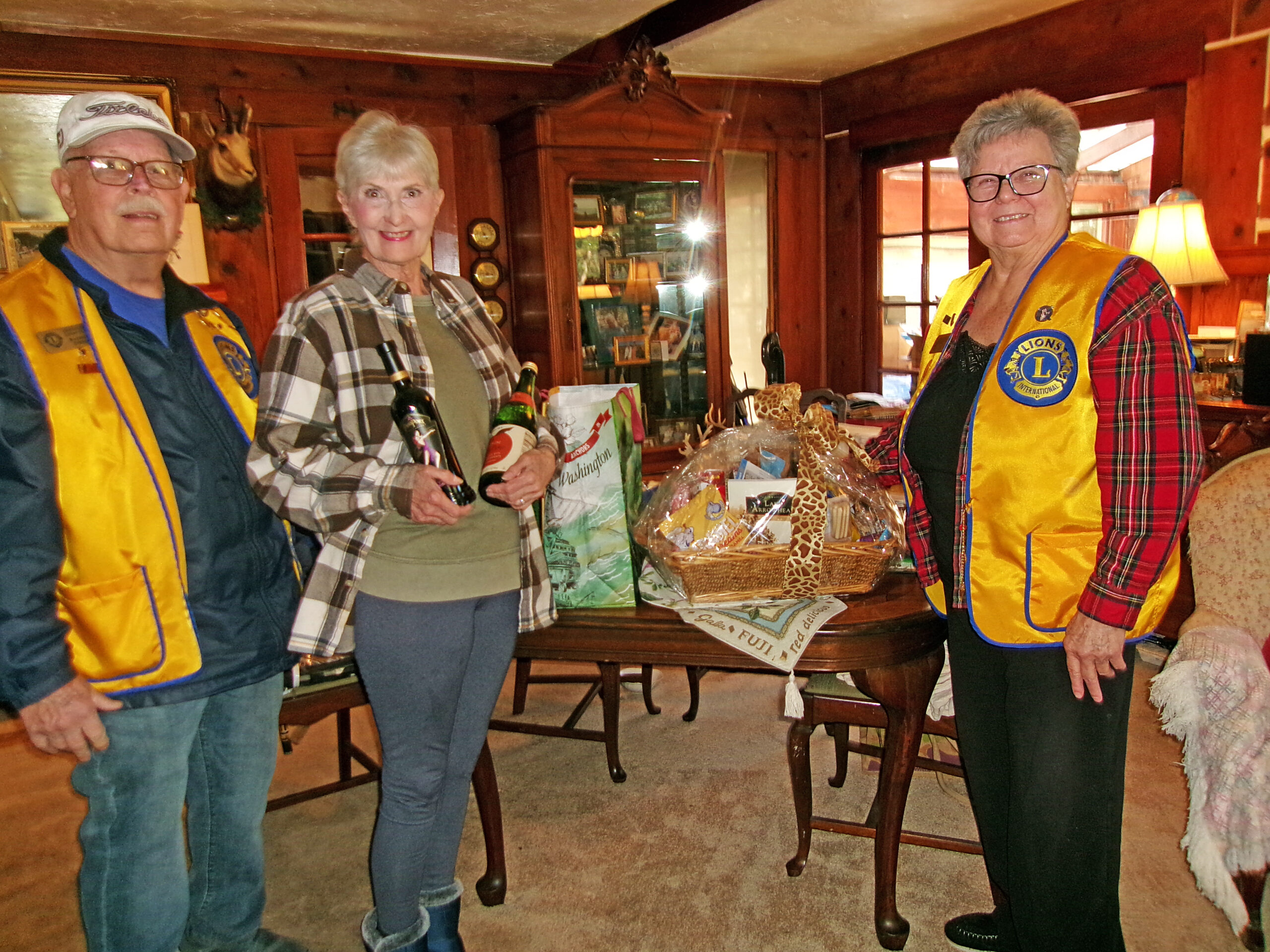 Adrianne, Lisa, Julia, Melissa and Adrianna from Glendora and Orange County enjoyed last year’s Brewfest at Tavern Bay Beach Club so much they couldn’t resist attending this year’s event. (Photos by Douglas W. Motley) Ray Johnson presented Kathleen Welsh the Lions Club basket filled with over $2,000 worth of items with Catherine Johnson on the right. (Photo by Rhea-Frances Tetley)