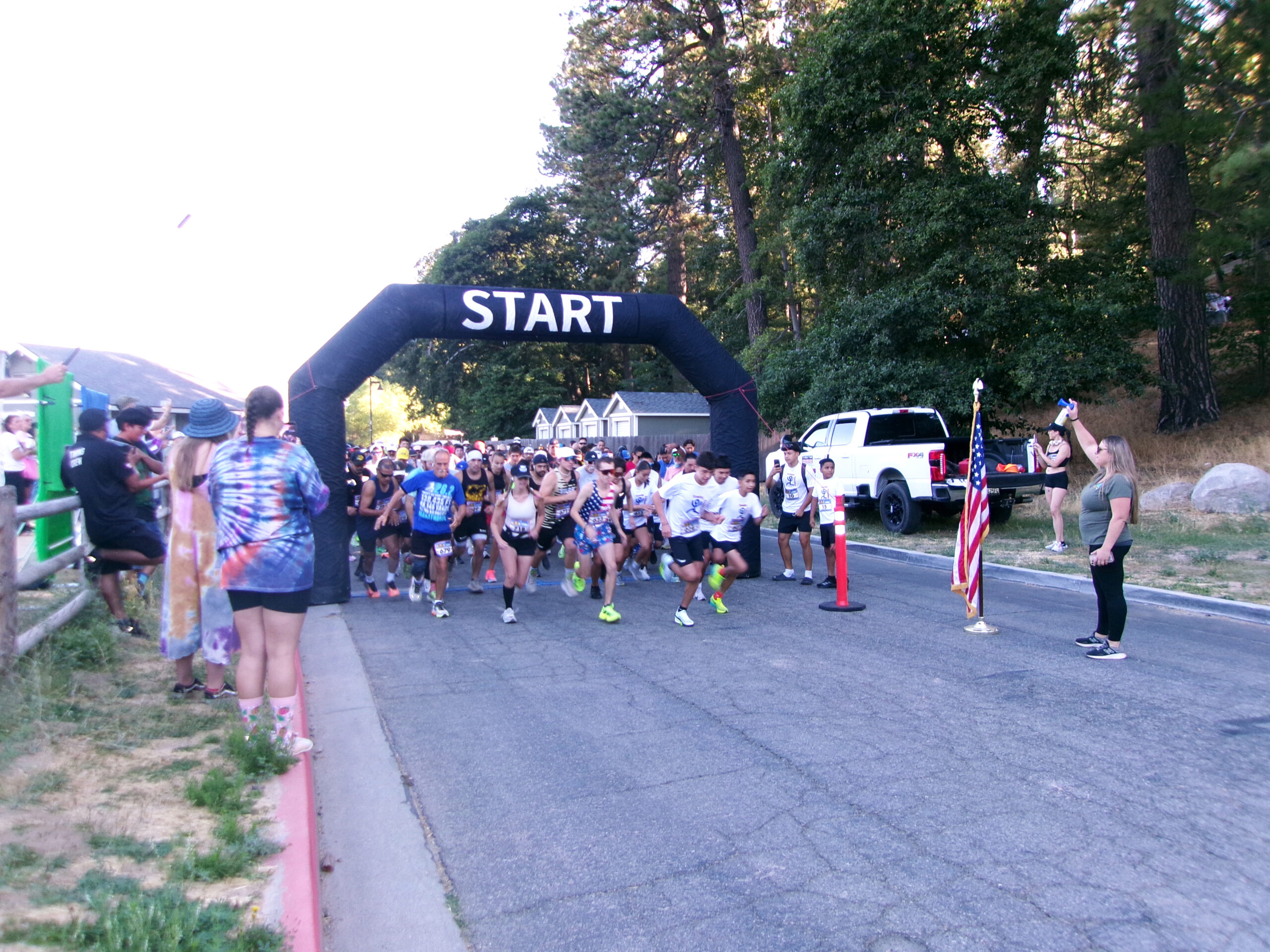 Runners in the 10k race rushed through the starting gate at 7:58 a.m. (Photo by Douglas W. Motley)